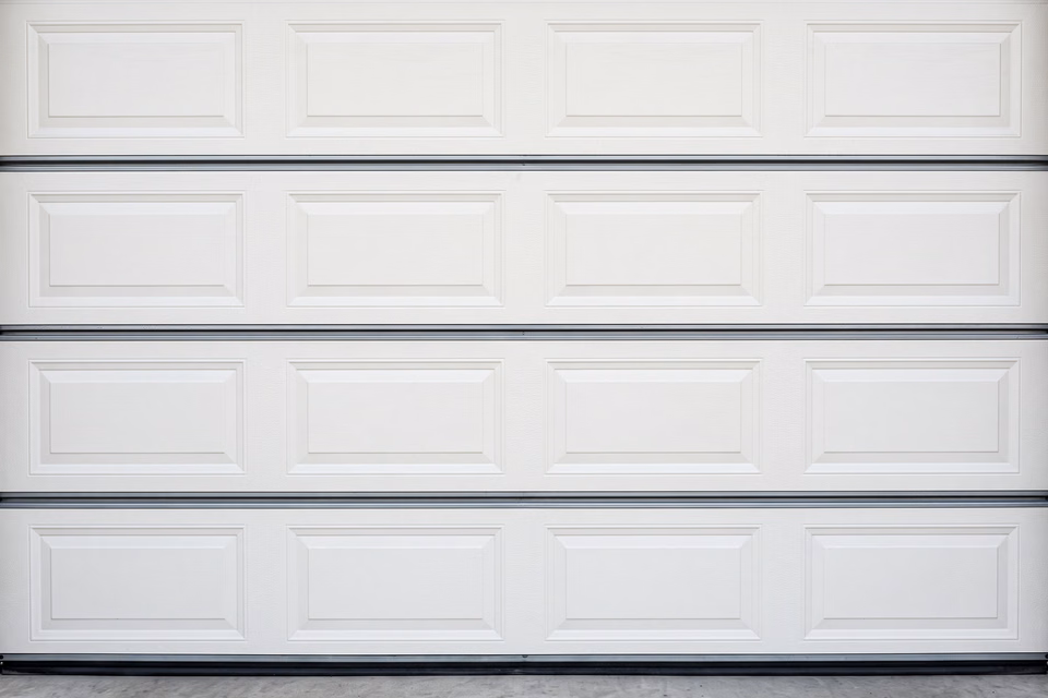 Insulated steel garage door on modern building
